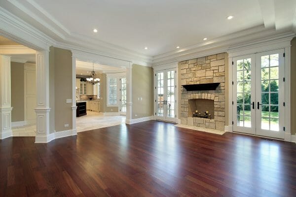 Living room in new construction home with stone fireplace